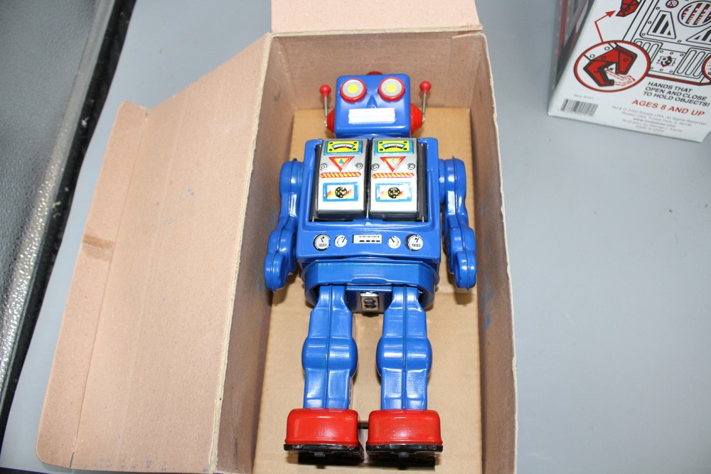 Four collectors robots, various, including a Rocket Toys R-1, two battery-operated ME 100 Space Walk Man (one black, one blue) and a